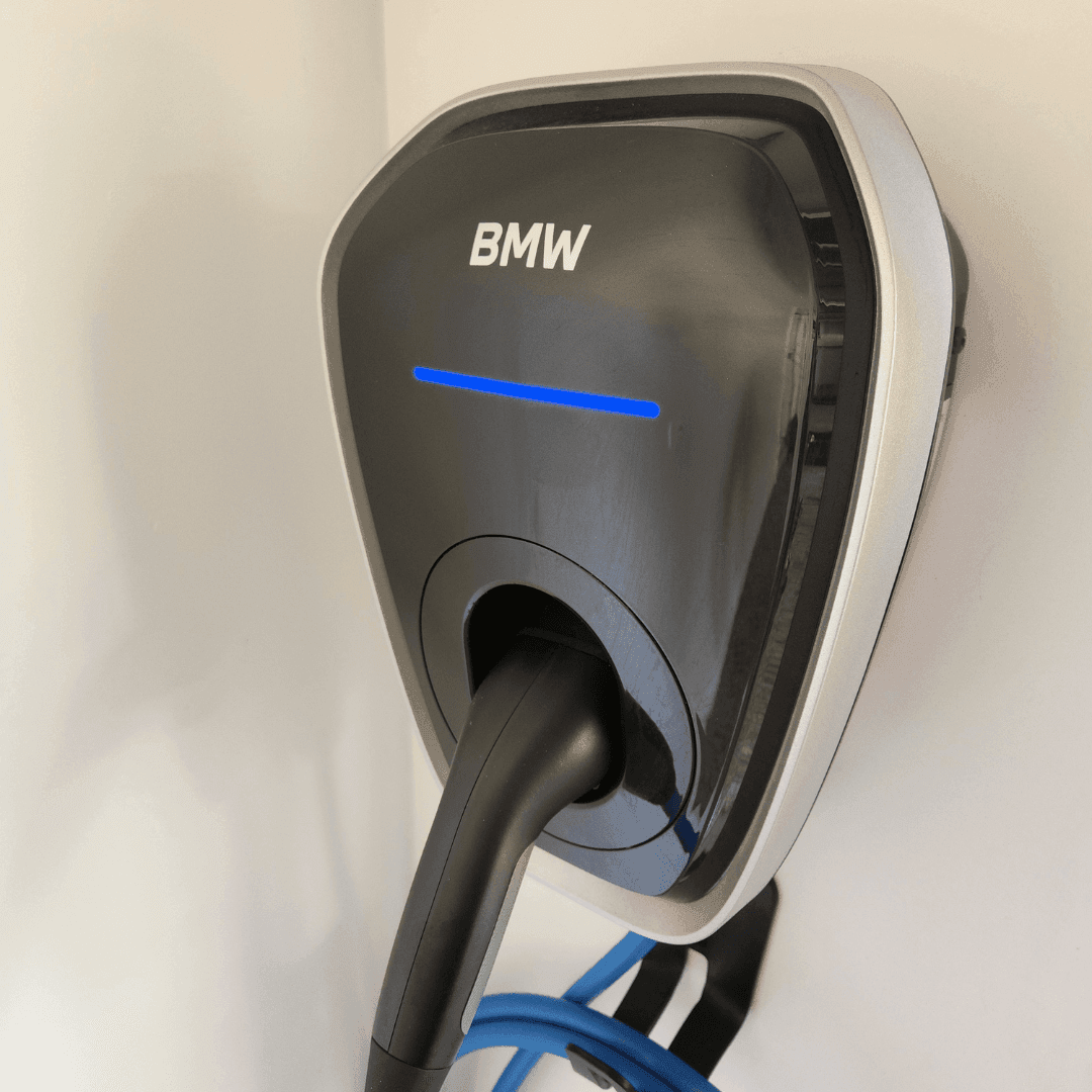 BMW electric vehicle EV charger with modern design, featuring BMW branding and green energy charging capabilities